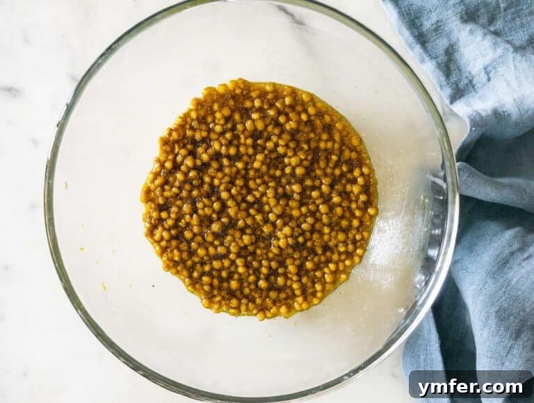 Step 2 Lentils tossed in dressing in large bowl ready for mixing.