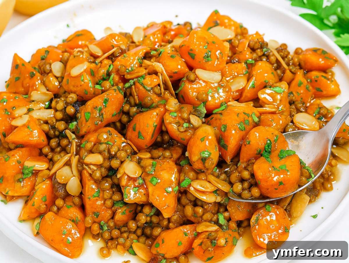 Vibrant Mediterranean Carrot and Lentil Salad 8 Step 4 Salad served on platter topped with toasted almonds and parsley.