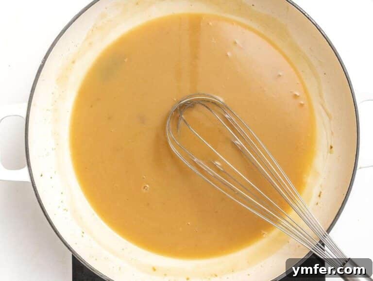 Step 3: Whisking flour, butter, broth, and soy sauce to skillet for thickening.