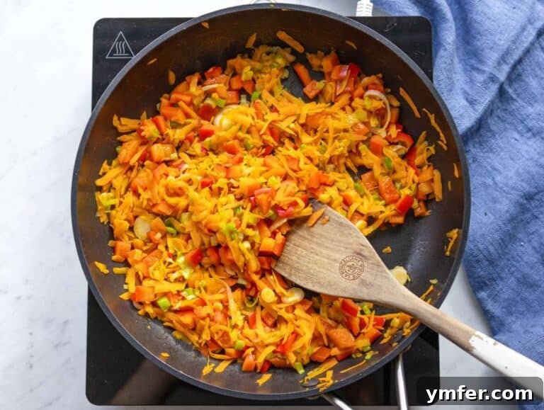 Step 2 Sautéed carrots peppers green onions in skillet for Mediterranean stir fry.