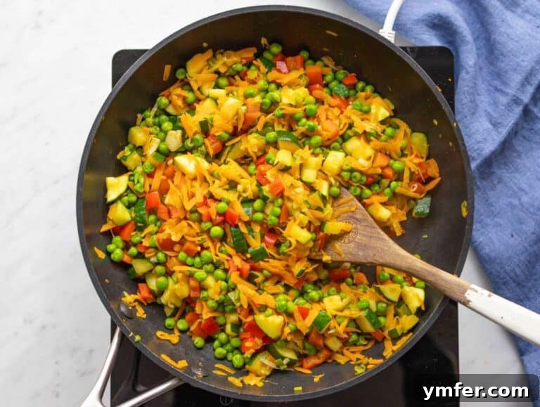 Step 3 Zucchini and peas added to skillet for easy veggie stir fry.