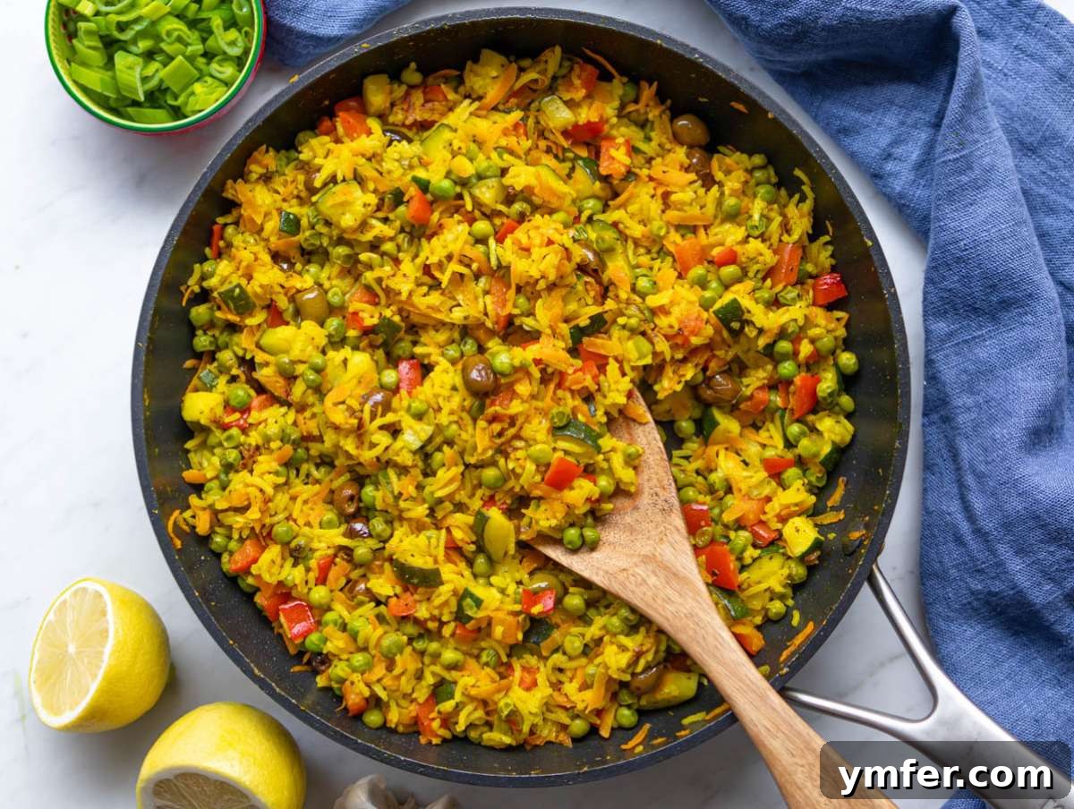 Golden Mediterranean Turmeric Vegetable Skillet 8 Step 4 Rice and olives mixed into golden skillet with turmeric sauce.