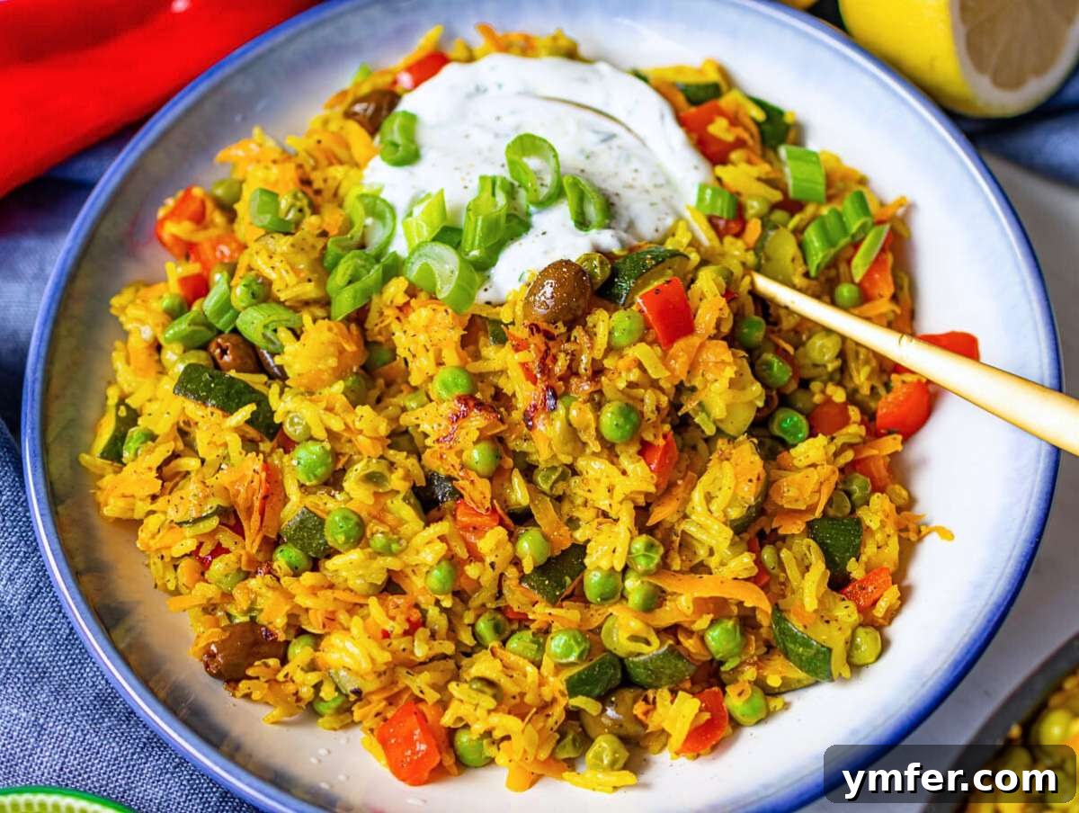 Golden Mediterranean Turmeric Vegetable Skillet 9 Step 5 Finished stir fry served with green onion tops and lemon yogurt drizzle.