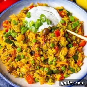 Golden Mediterranean Stir Fry with colorful vegetables rice cooked in turmeric sauce.