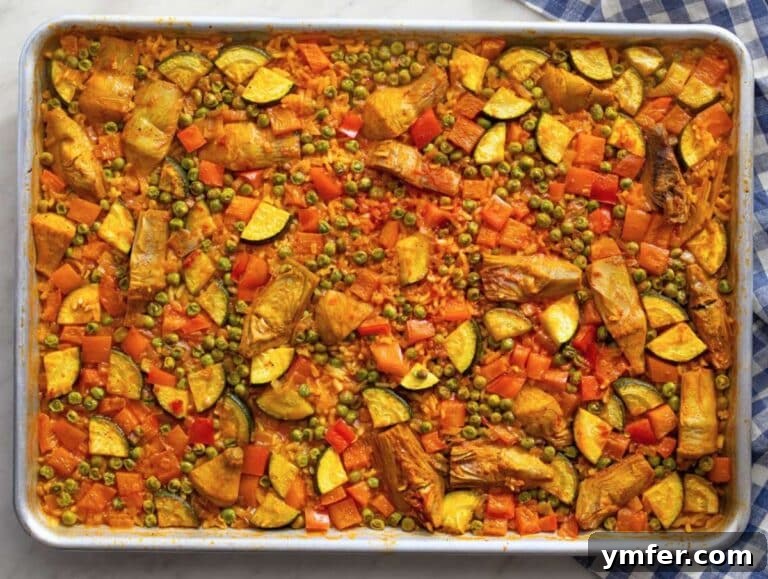 Effortless One-Pan Vegetable Paella 12 Step three Vegetable Paella baking in oven until rice is tender and edges caramelized.
