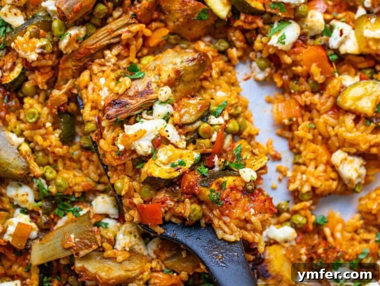 Effortless One-Pan Vegetable Paella 13 Step four Feta sprinkled and broiled for crisp flavorful finish on Vegetable Paella.