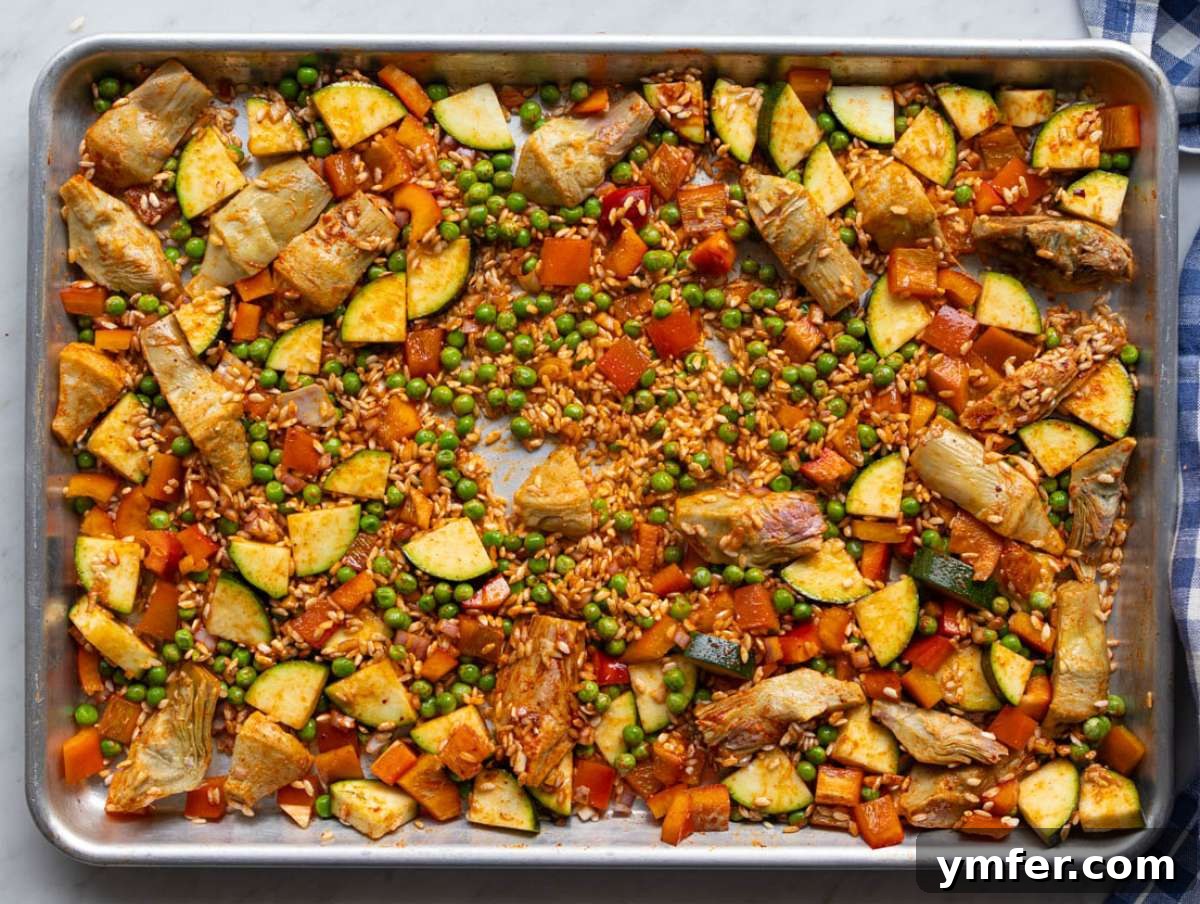Effortless One-Pan Vegetable Paella 5 Step one Veggies rice and spices mixed on sheet pan.