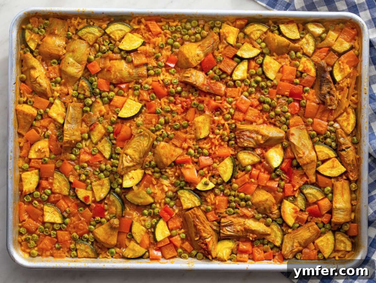 Effortless One-Pan Vegetable Paella 7 Step three Vegetable Paella baking in oven until rice is tender and edges caramelized.