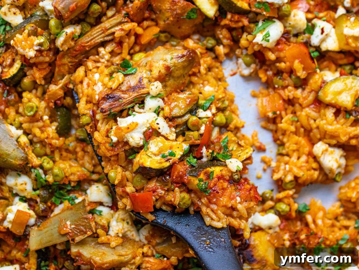 Effortless One-Pan Vegetable Paella 8 Step four Feta sprinkled and broiled for crisp flavorful finish on Vegetable Paella.