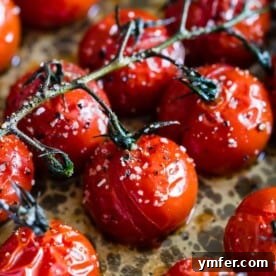 These on the vine roasted tomatoes are the packed full of flavor and the perfect use for all your summer tomatoes. Perfectly roasted and great on salads, thrown in pasta or just eaten plain. So simple and easy to make!