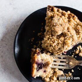 Berry Burst Coffee Cake 6 This mixed berry coffee cake is perfect for breakfast or dessert. Tender cake made with Greek yogurt, filled with fresh picked black raspberries and blackberries and topped with a crunchy brown sugar crumbly topping. This cake is perfect for summer!