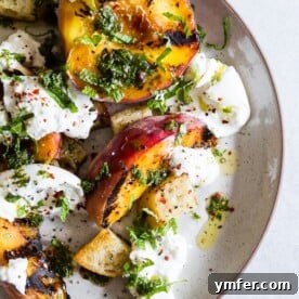 grilled peach burrata salad on a plate