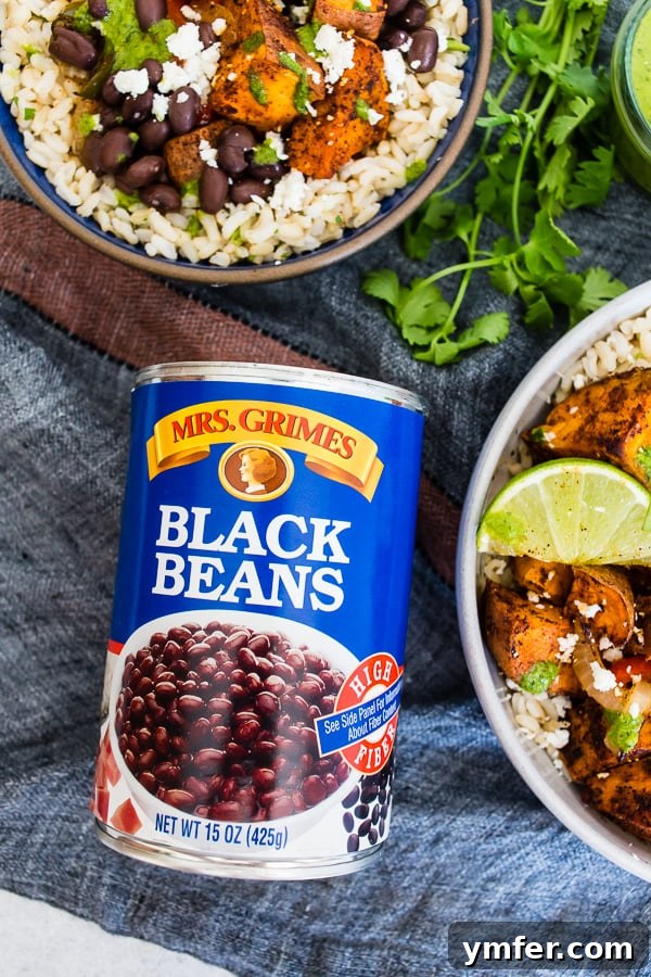Sweet Potato Black Bean Fiesta Bowls 3 Sweet Potato Black Bean Burrito Bowls in a serving bowl alongside a can of Mrs. Grimes black beans, ready for assembly.