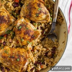 This one pot Cajun chicken and rice is the perfect fall meal. Packed full of flavor and prepared all in one pot. Crispy roast Cajun spiced chicken thighs on top of seasoned rice packed with Andouille sausage and red kidney beans. You’ll love how easy it is to throw together and clean up is a breeze.