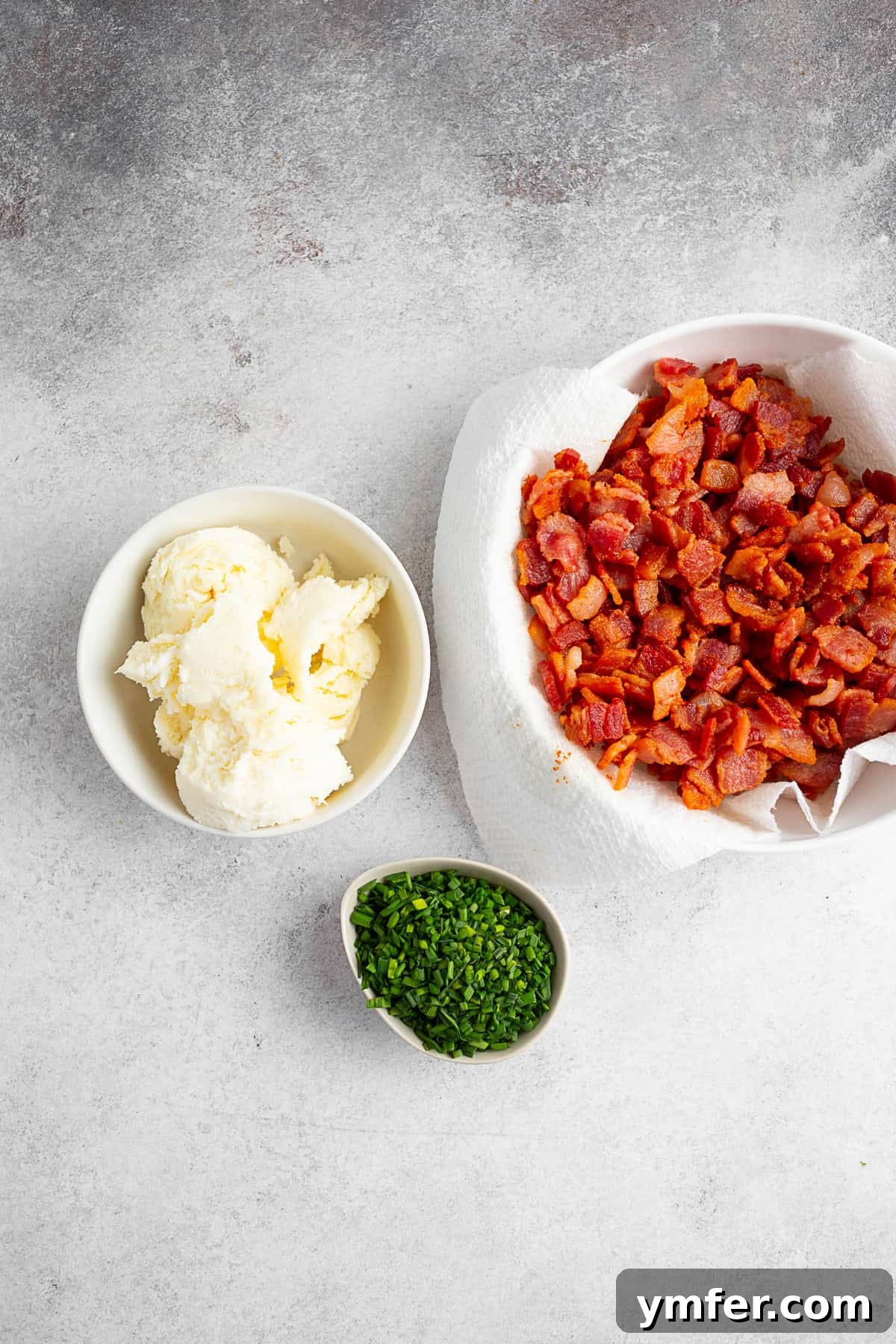 Slovak Bryndza Potato Dumplings 7 Bacon, chives, and cheese on a table.