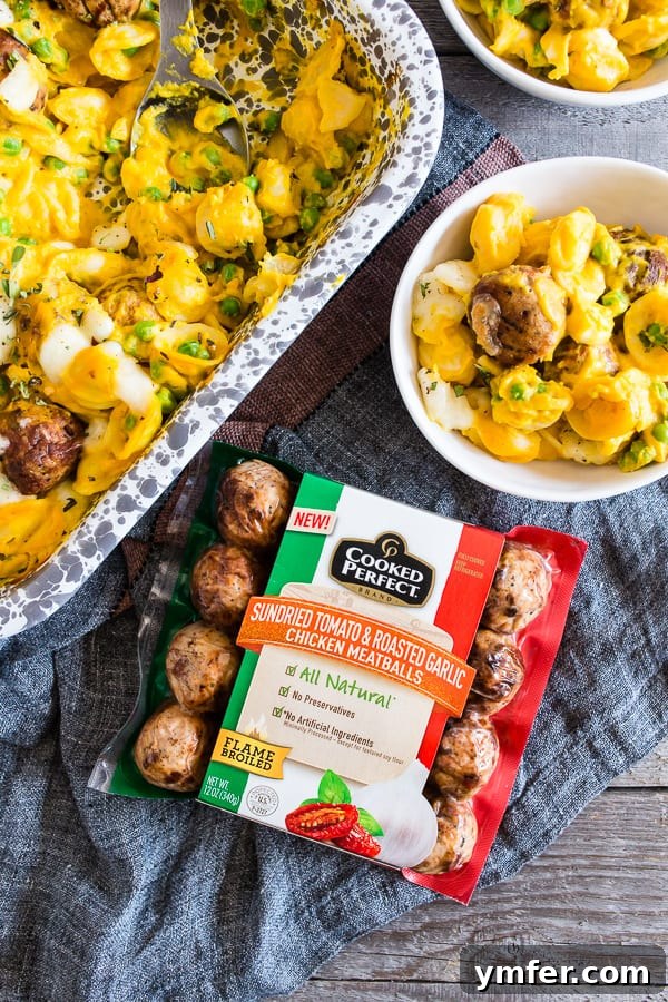 Autumn Comfort: Pumpkin Alfredo Meatball Pasta Bake 4 A serving of Pumpkin Cauliflower Alfredo Meatball Pasta Bake alongside a bowl of extra chicken meatballs, ready for a hearty meal.