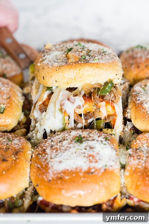 2017's Standout Content 10 Baked supreme pizza sliders: loaded with marinara sauce, spicy Italian sausage, pepperoni, mushrooms, green peppers, onions, and lots of mozzarella cheese, all on soft potato rolls – perfect for parties.