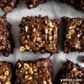 These hazelnut buckwheat brownies are packed full of dark chocolate, semisweet chocolate chips, and chopped hazelnuts. They are super fudgy and made with a delicious mix of buckwheat and white whole wheat flour. Trust me, you'll love these brownies! 