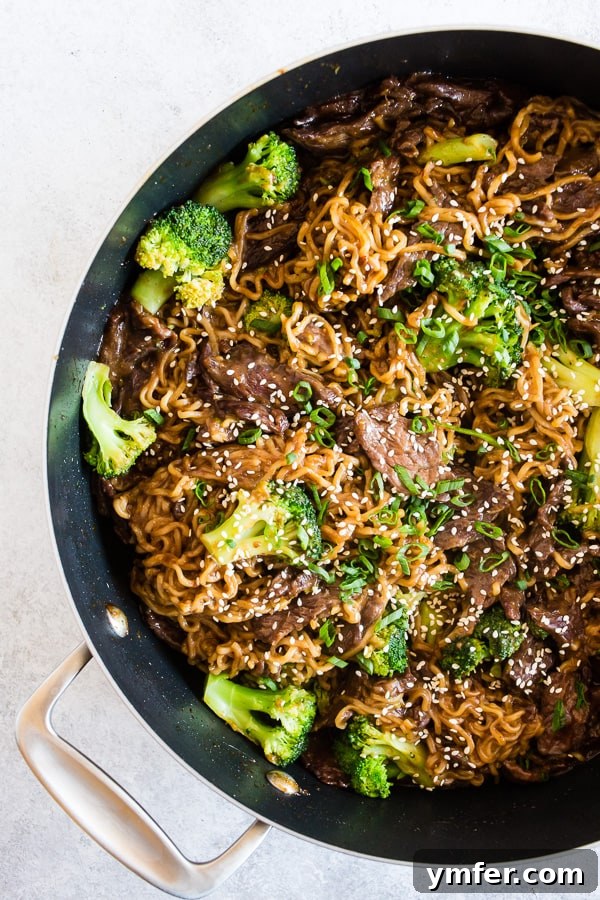 Large pan filled with Easy Beef and Broccoli Ramen Noodles, ready to be served.