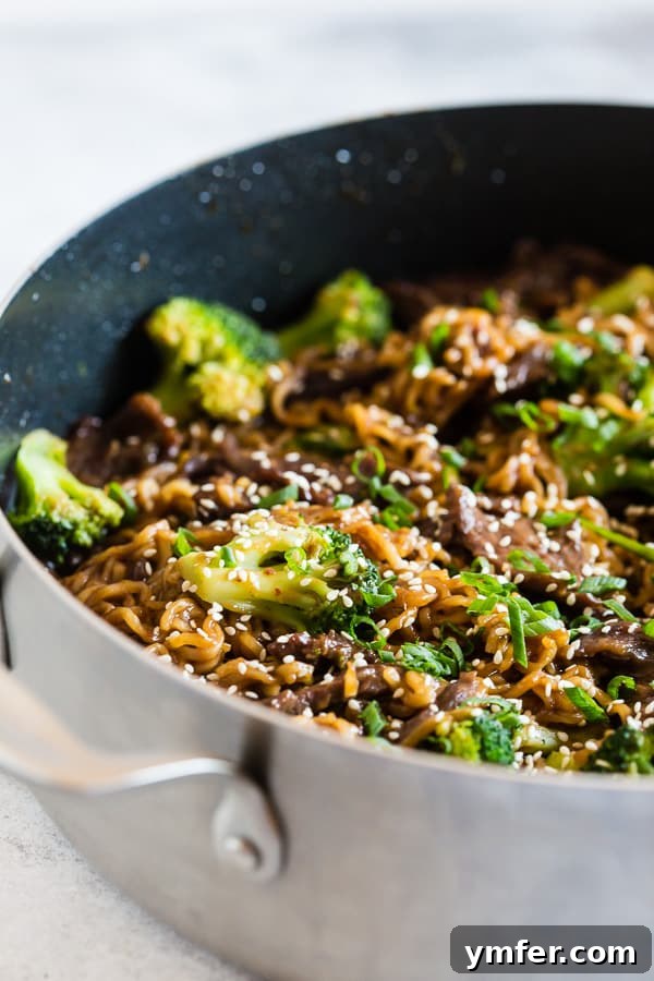 Plated Beef and Broccoli Ramen Noodles, garnished with sesame seeds.
