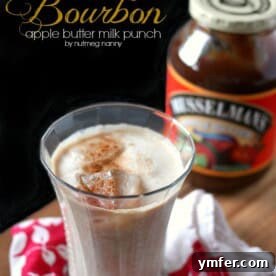 A glass of refreshing Bourbon Apple Butter Milk Punch, perfect for a cozy evening.