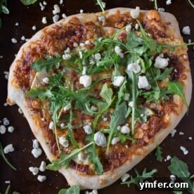 A gourmet apple butter pizza topped with savory blue cheese and crispy pancetta.