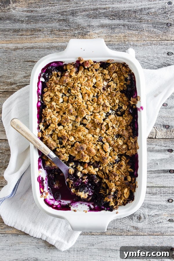 Rustic Rhubarb & Berry Crumble 2 A beautifully baked blueberry rhubarb crisp, golden brown and bubbly, ready to be served. It's a perfect summer dessert with a crunchy oat topping.