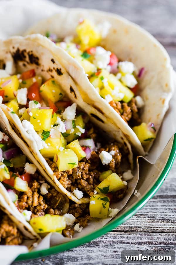 Aloha Pork Tacos with Pineapple Salsa 4 A vibrant close-up of the fresh pineapple salsa, showcasing diced pineapple, red onion, bell pepper, and cilantro.