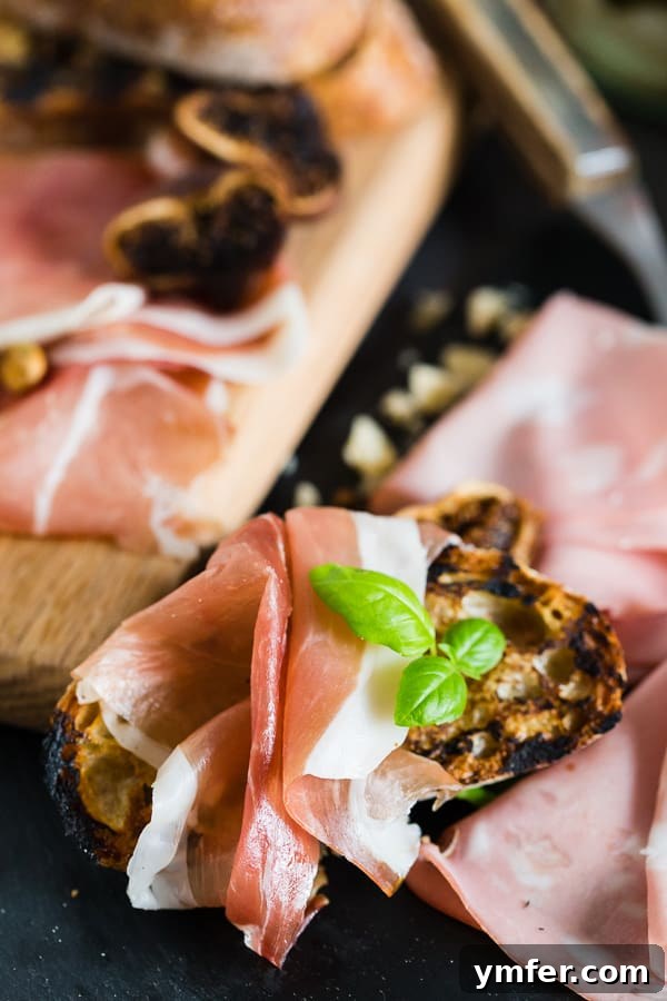 Close-up of thin-sliced meat on a toasted crust of bread.