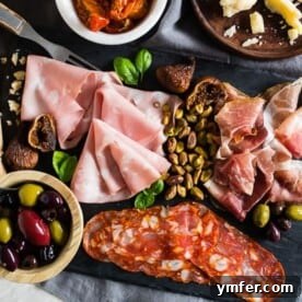 This Italian salumi board is the perfect combination of delicious imported Italian meats, imported Italian cheese, nuts, dried fruit, olives, roasted tomatoes, pickled vegetables and grilled bread. It makes a great appetizer or a simple summer meal - no cooking required! 
