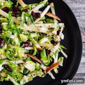 Zesty Apple & Brussels Slaw 6 This tangy Brussels sprout apple slaw is a great addition to your fall menu. Crispy shaved Brussels sprout combined with dried cranberries, and apples all tossed in a homemade shallot whole grain mustard vinaigrette. You'll love this simple side dish!