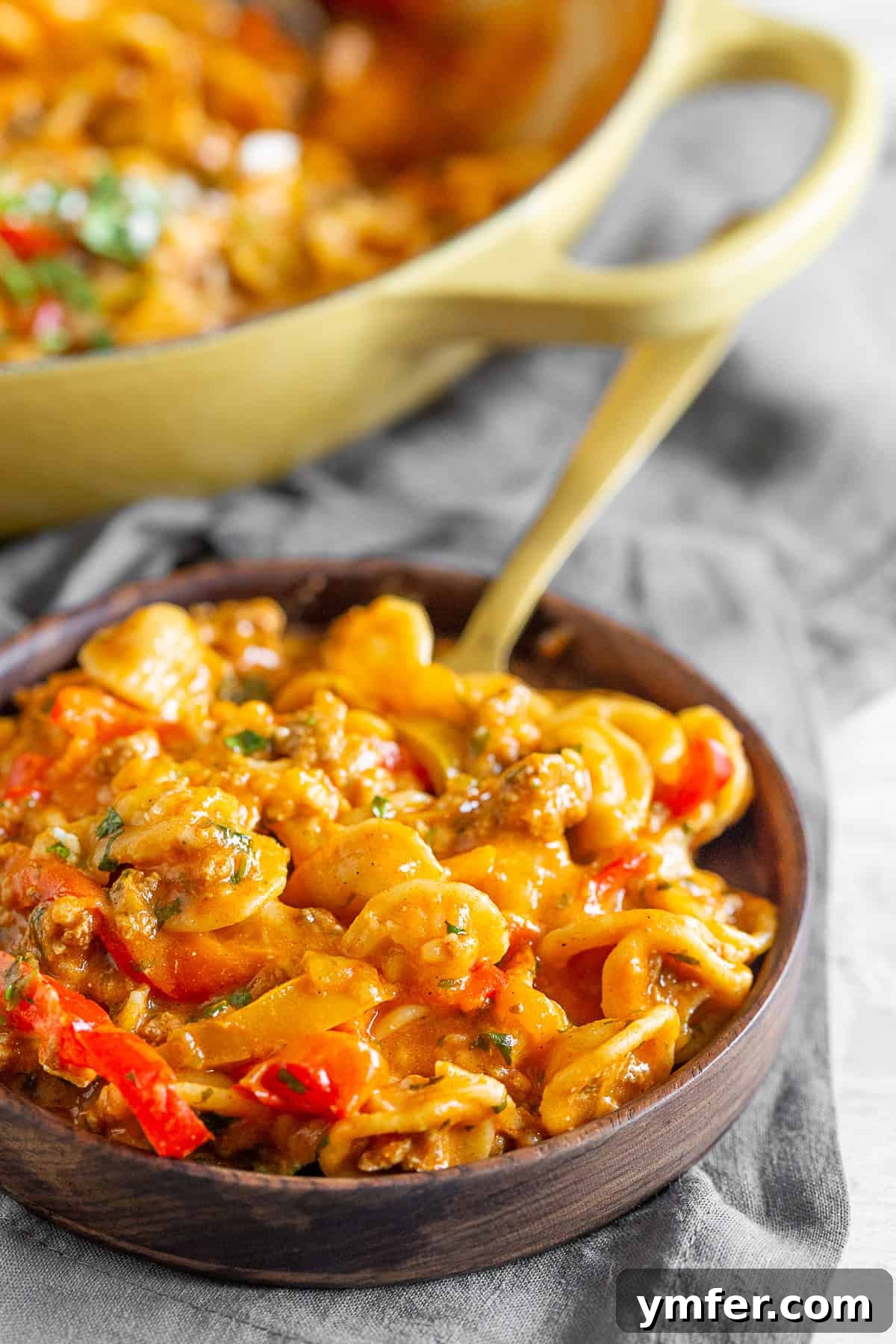 Zesty One-Pot Ground Chicken Fajita Pasta 5 A serving of One-Pot Ground Chicken Fajita Pasta spooned onto a white plate, ready to be enjoyed.