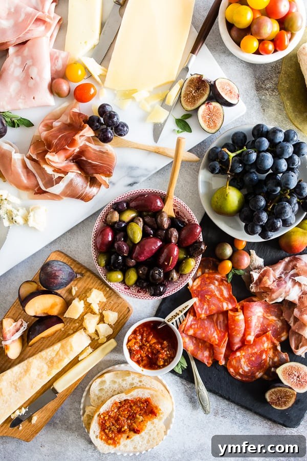 Gourmet Italian Antipasto Board 2 A stunning Ultimate Italian Antipasto Platter elegantly arranged on a white marble board, featuring an array of gourmet Italian meats, artisanal cheeses, fresh fruits, and nuts.