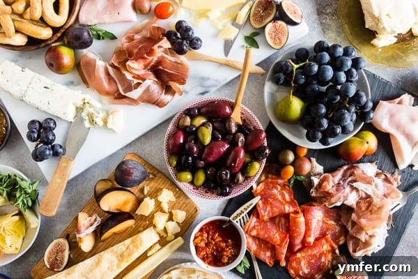 Gourmet Italian Antipasto Board 7 A wide shot of the Ultimate Italian Antipasto Platter, impeccably arranged against a clean white background, highlighting its abundant and appealing spread of Italian delicacies.