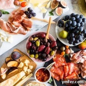 Ultimate Italian Antipasto Platter laid out on a white marble board