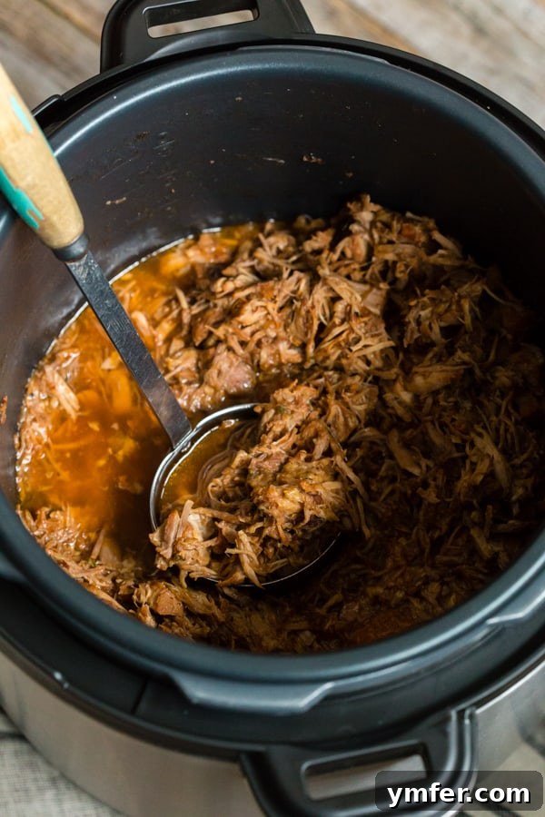 Cranberry Infused Instant Pot Pulled Pork 5 Instant Pot Cranberry Sauce Pulled Pork cooking inside the Instant Pot, highlighting the ease of pressure cooking.