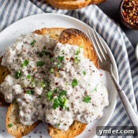 sos creamed beef recipe on a white plate with a fork