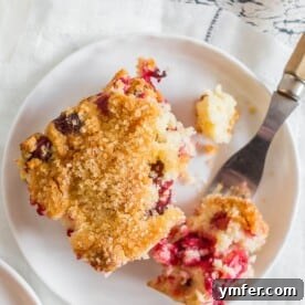 This vanilla cranberry buttermilk cake is the perfect Christmas cake. Full of fresh cranberries, vanilla beans, orange zest and a sprinkle of turbinado sugar on top for an extra special sparkly surprise. You'll love how easy it is to make this tasty breakfast or dessert treat!