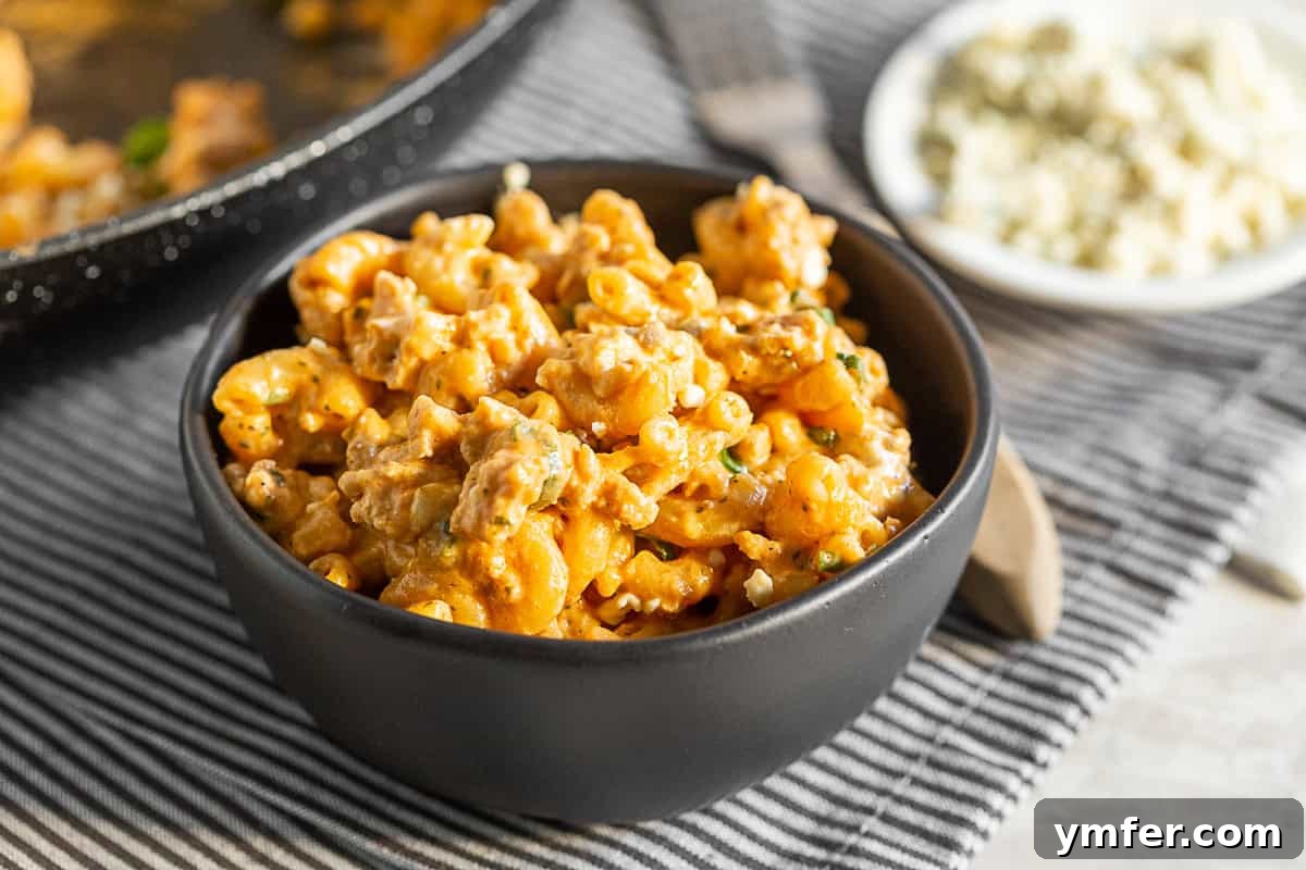 Creamy One Pot Buffalo Chicken Pasta 3 A smaller bowl showcasing a serving of One Pot Buffalo Chicken Pasta, highlighting the creamy sauce and bits of chicken.