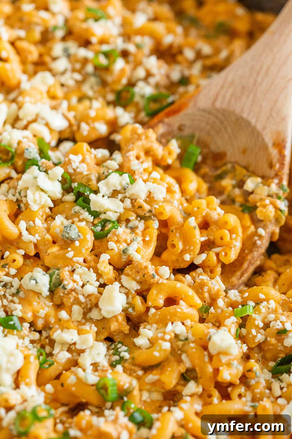 Creamy One Pot Buffalo Chicken Pasta 6 An up-close shot of One Pot Buffalo Chicken Pasta, clearly showing the crumbled blue cheese mixed into the creamy sauce.