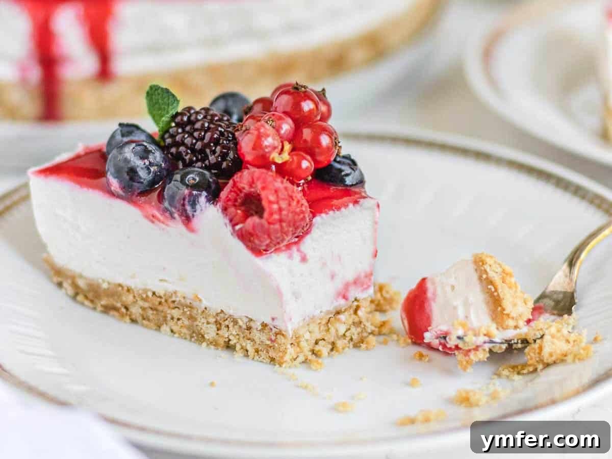 Creamy No-Bake Vegan Cheesecake 12 A delectable slice of vegan cheesecake with a fork, ready to be enjoyed.