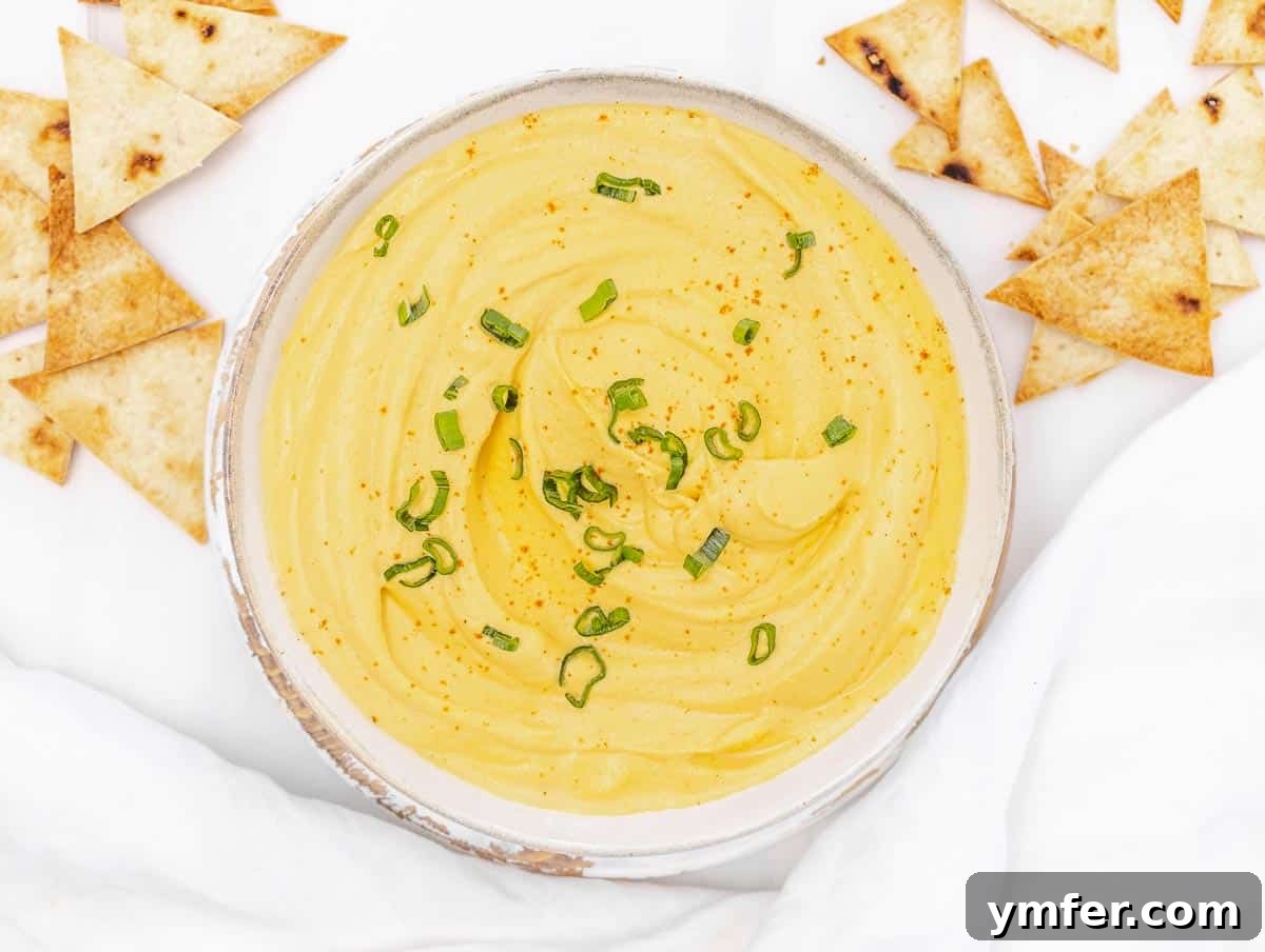 5-Minute Nut-Free Vegan Cheese Recipe 13 smooth and creamy vegan queso dip in a bowl