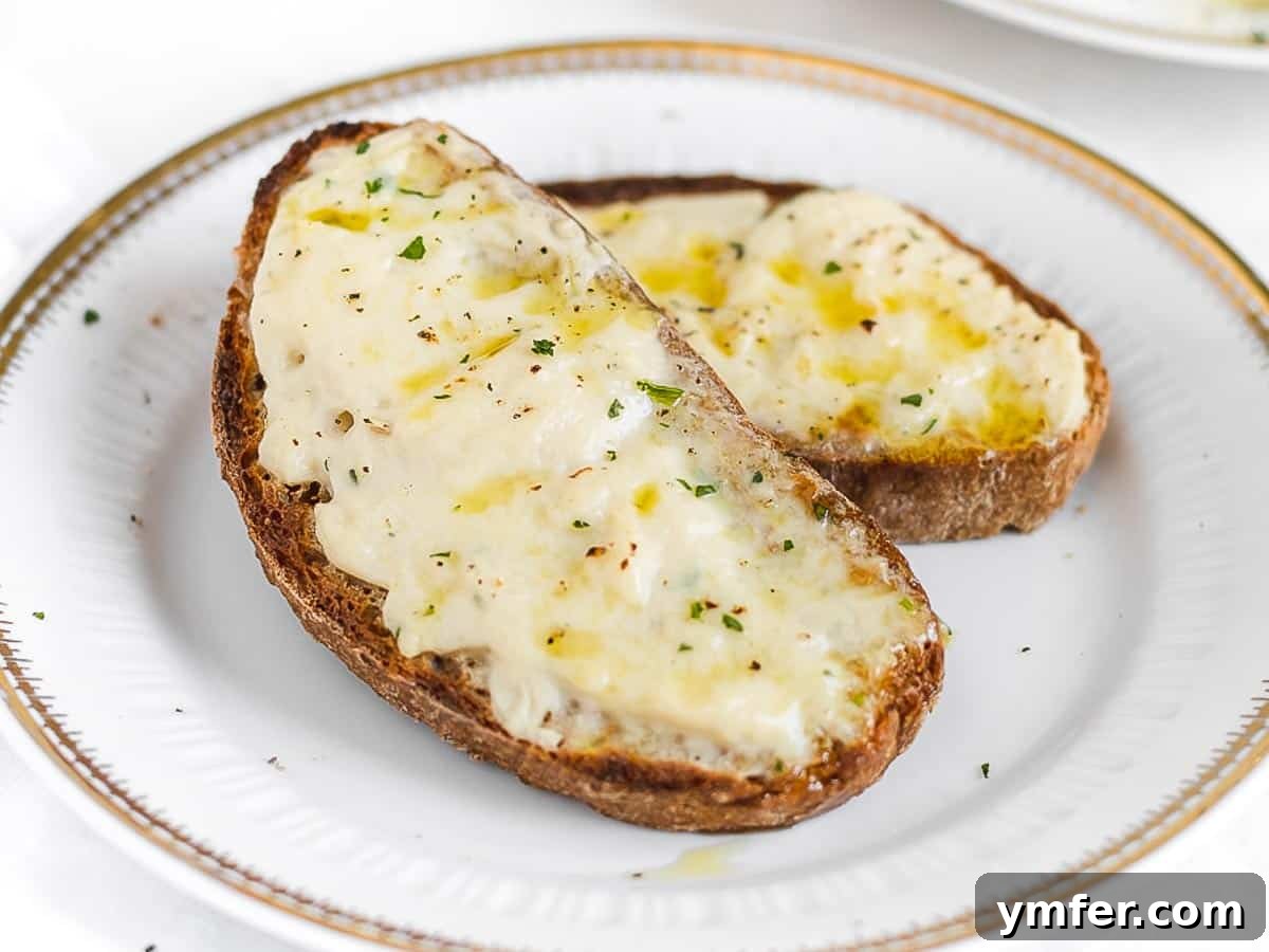 5-Minute Nut-Free Vegan Cheese Recipe 3 melted vegan cheese on toasted bread with fresh herbs