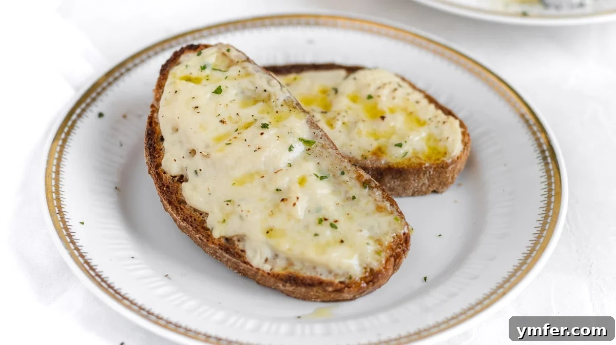 5-Minute Nut-Free Vegan Cheese Recipe 9 melted vegan cheese spread on a slice of bread