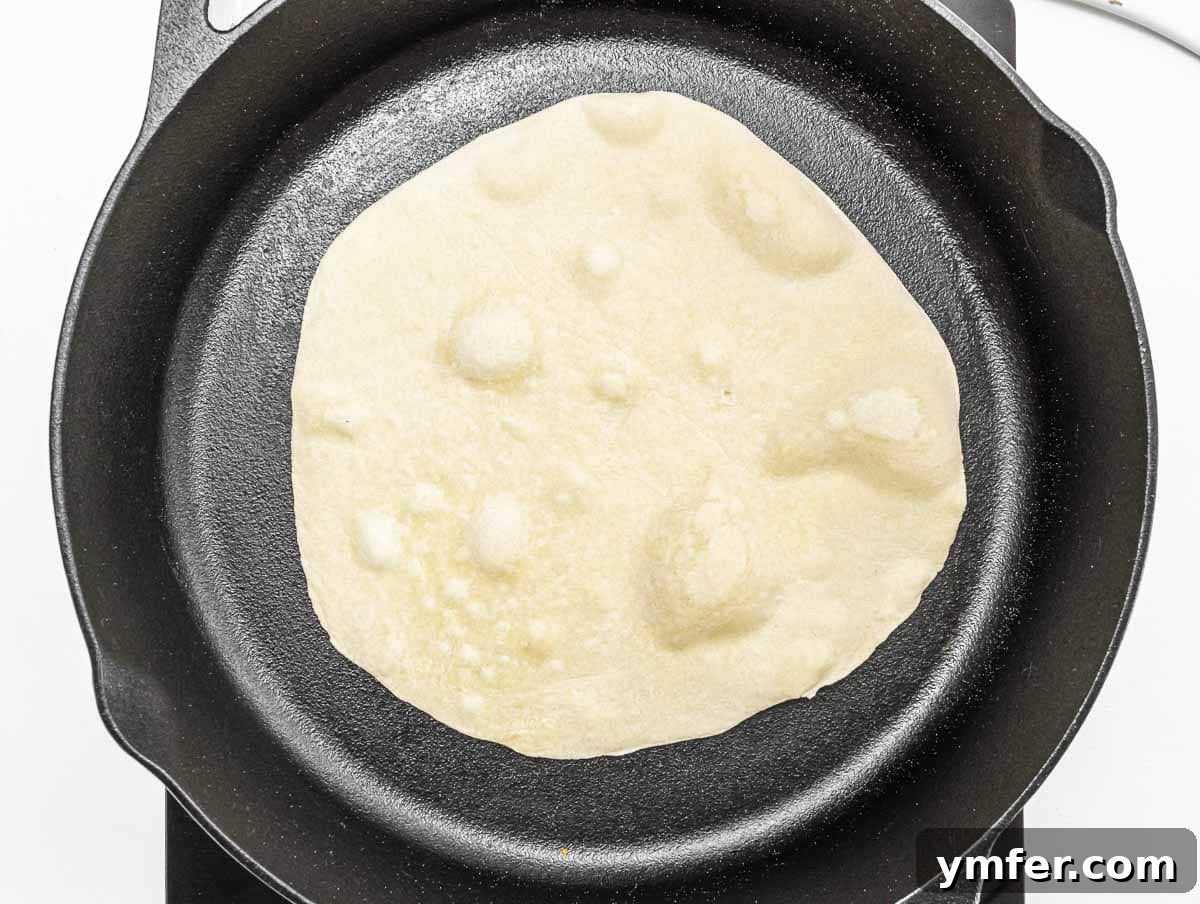 cooking the piadina on a cast iron skillet