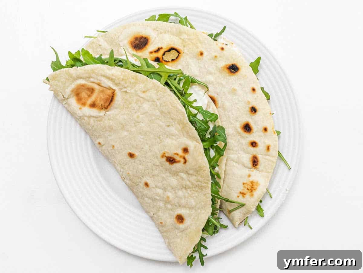 Piadina on a white plate with filling