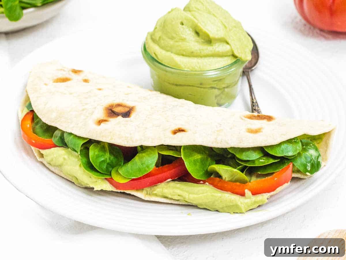 Piadina with avocado spread and tomatoes