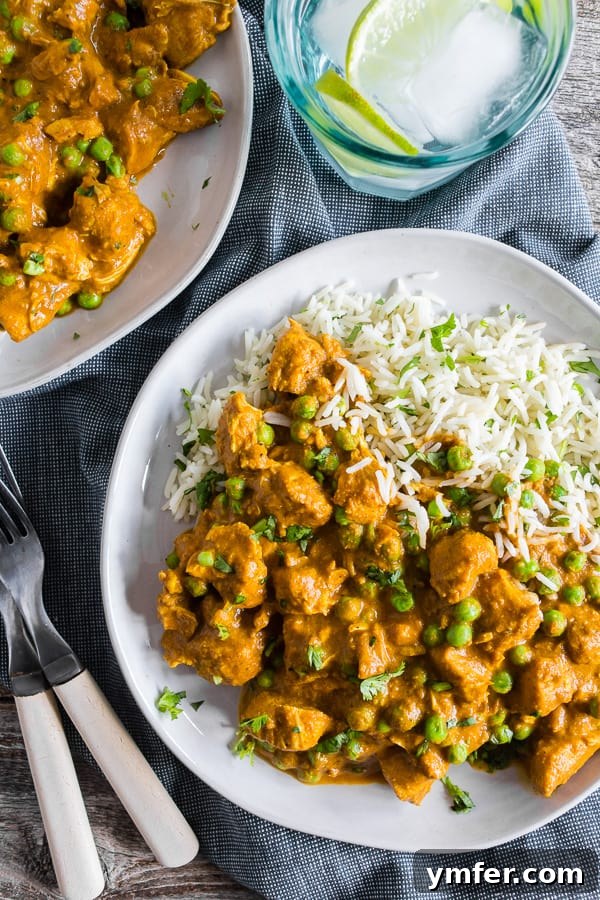 Restaurant-Quality Instant Pot Chicken Tikka Masala 2 Instant Pot Chicken Tikka Masala on 2 plates, ready to be served over basmati rice.