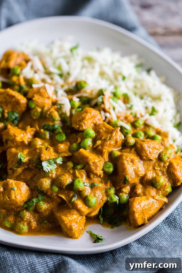 Restaurant-Quality Instant Pot Chicken Tikka Masala 3 A close-up of Instant Pot Chicken Tikka Masala on a plate with basmati rice, showcasing the creamy sauce and tender chicken.