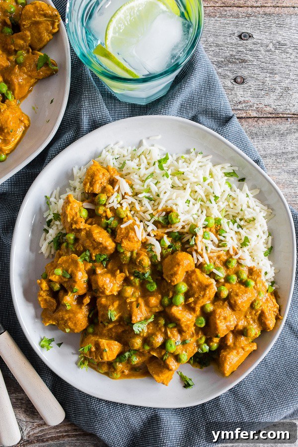 Restaurant-Quality Instant Pot Chicken Tikka Masala 4 A serving of Instant Pot Chicken Tikka Masala with basmati rice, garnished with fresh cilantro, showcasing its rich, creamy texture.